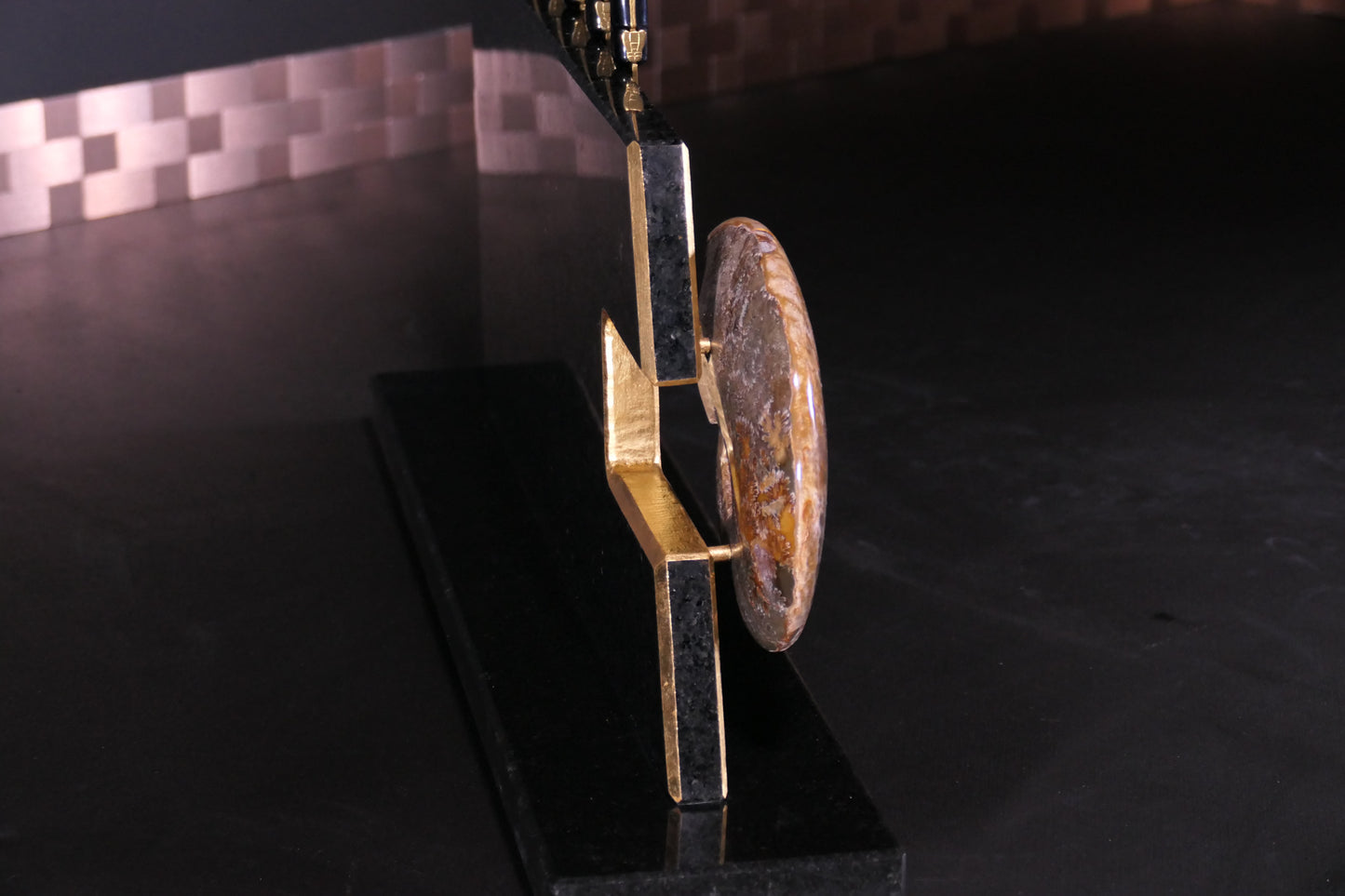 Knife block made of Nero Impala with gold plating and an ammonite