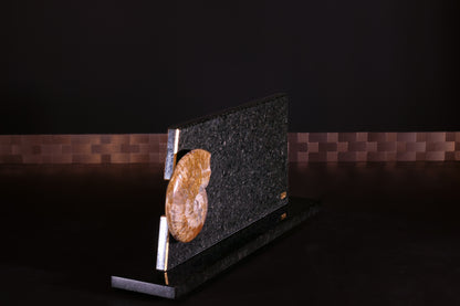 Knife block made of Nero Impala with gold plating and an ammonite