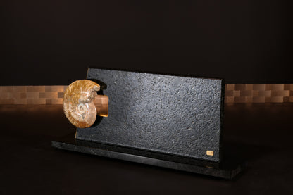 Knife block made of Nero Impala with gold plating and an ammonite