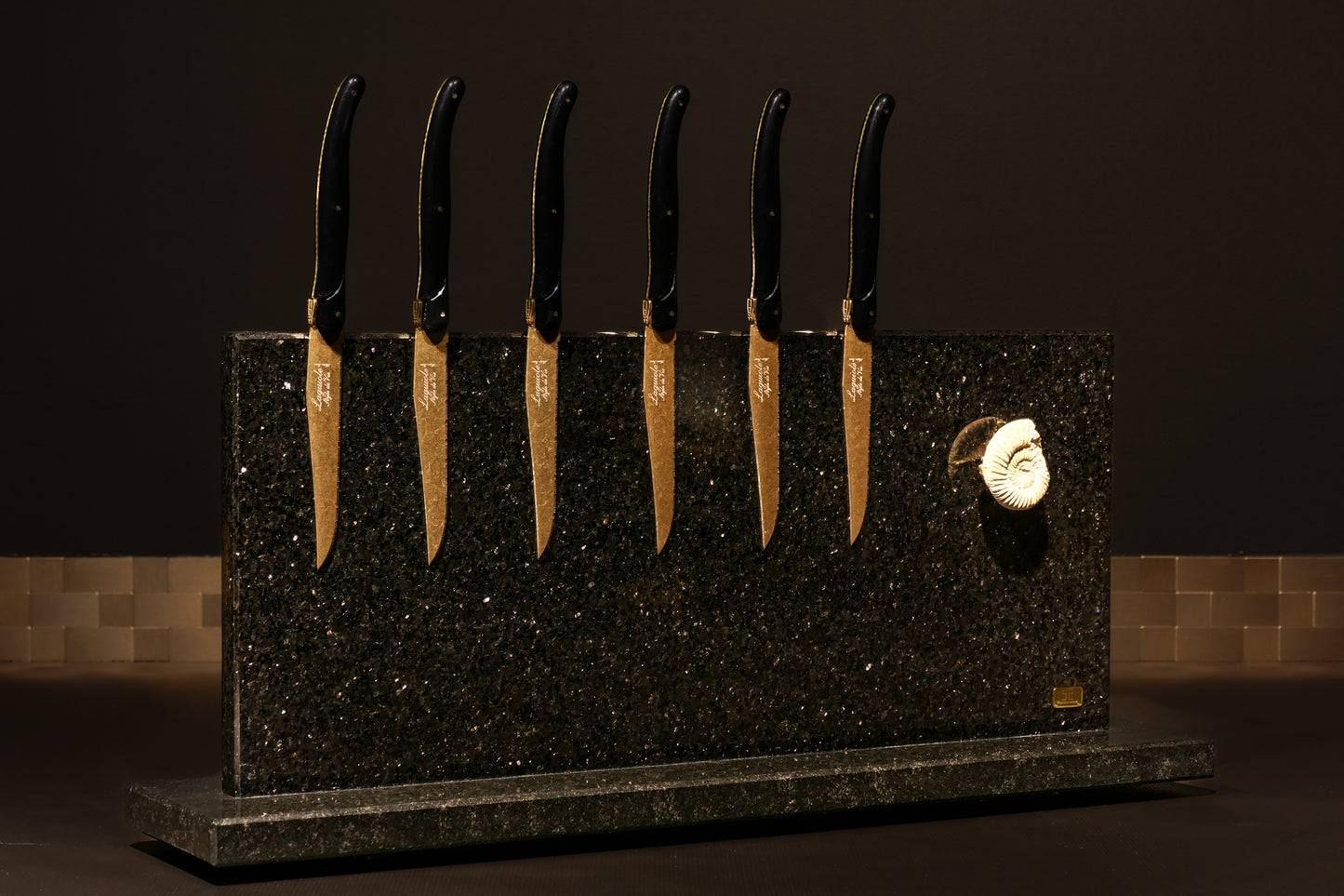 Star Galaxy Gold knife block with a fossilized ammonite