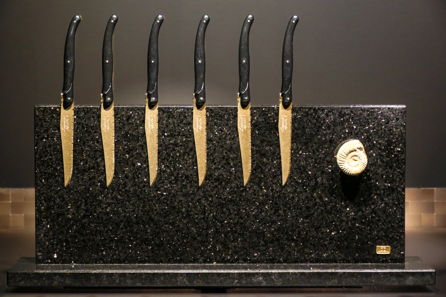 Star Galaxy Gold knife block with a fossilized ammonite