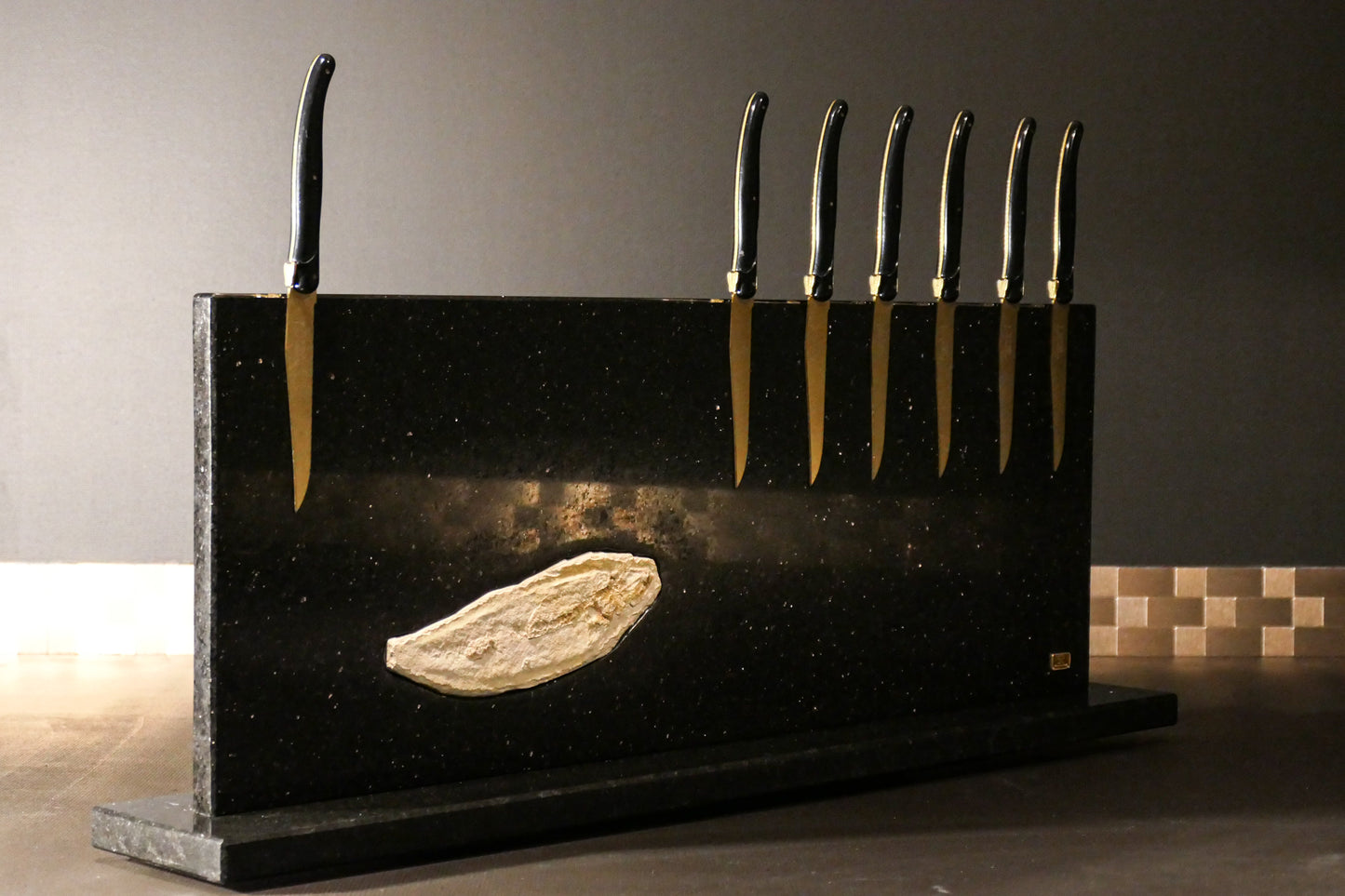 Star Galaxy Gold knife block with a fossilized fish