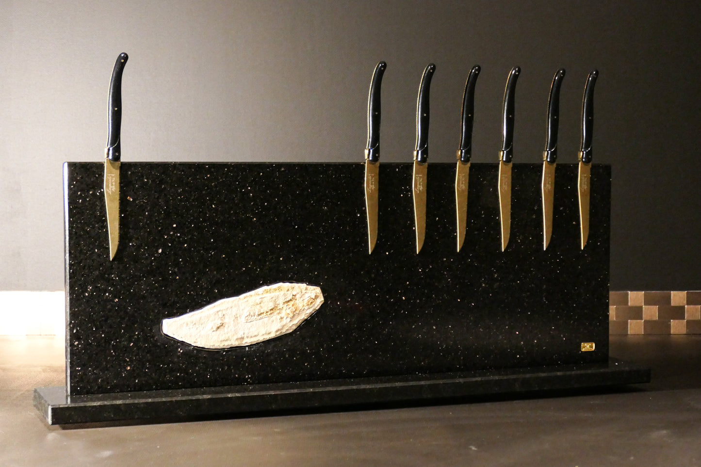 Star Galaxy Gold knife block with a fossilized fish